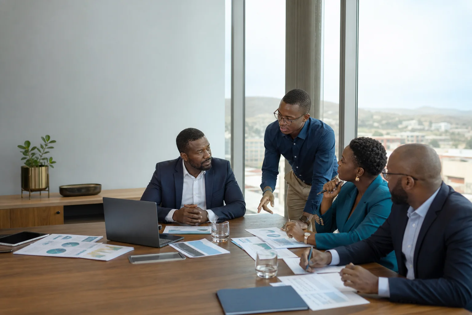 Black African executives evaluating a technology partnership in Windhoek